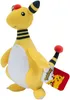 A yellow plush toy of the Pokémon Ampharos is shown against a white background. A red tag with the Pokémon logo and an image of Pikachu is attached to the toy's tail. Voir les images du produit