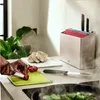 A person is chopping tomatoes on a cutting board in a kitchen. Anteprima dell’immagine prodotto