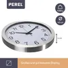 A close-up, angled view of a silver analog wall clock with a white face and black numbers and hands, set against a white background. Informational icons and text are present on the right and top-left of the image. Voir les images du produit