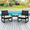 Two black rattan chairs with beige cushions and a small black table with drinks and a bowl of fruit are placed on a wooden deck next to a swimming pool. Podgląd zdjęcia produktu