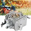 A close-up of a lawnmower carburetor with a blurred background of a person mowing a lawn. Náhled obrázku produktu