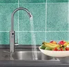 A kitchen sink with a faucet running water into it, and a bowl of fruit next to it. Náhled obrázku produktu