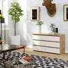 A modern living room with a dresser, plant, and coffee table. Produktbild-Vorschau