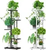 Two identical metal plant stands, one black and one white, are shown side-by-side, each filled with various potted plants. Náhľad obrázku produktu