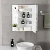 A white medicine cabinet with various toiletries and decorative items displayed on its shelves, mounted on a gray tiled wall above a sink. Produktbild-Vorschau