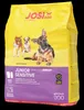 A bag of dog food with images of puppies on it. Produktbild-Vorschau