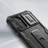 Close-up of the back of a black smartphone case with a built-in kickstand and camera protection. Náhľad obrázku produktu