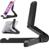 A black adjustable stand for phones and tablets is shown in multiple views against a white background. Náhled obrázku produktu