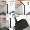 A collage of images showing a black toilet paper holder with toilet paper rolls. Podgląd zdjęcia produktu
