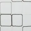 A close-up view of a white shower curtain with a pattern of rounded squares outlined in gray and black. Podgląd zdjęcia produktu