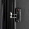 Close-up of a TSA lock on a black suitcase. Produktbild-Vorschau