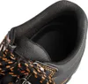 A close-up view of the interior of a black work shoe, showing the padded collar and laces. Anteprima dell’immagine prodotto
