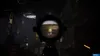 A first-person view through a rifle scope, showing a desolate, post-apocalyptic environment with a distant figure in a field. Produktbild-Vorschau