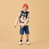 A young boy wearing a backpack and a beanie stands against a plain background. Podgląd zdjęcia produktu
