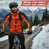 A man is mountain biking on a snowy trail with mountains in the background. Produktbild-Vorschau