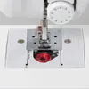 Close-up view of the needle, presser foot, and bobbin area of a sewing machine. Podgląd zdjęcia produktu