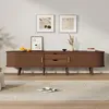 A modern living room scene featuring a wooden TV stand with decorative items and artwork on the wall. Podgląd zdjęcia produktu