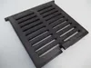 A black cast iron grate with parallel slots is shown on a white background. Voir les images du produit