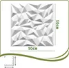 A white 3D wall panel with a geometric design, shown flat against a white background with dimensions indicated. Podgląd zdjęcia produktu