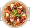 A round pizza stone with a pizza on it, presented on a white background with a metal rack. Podgląd zdjęcia produktu