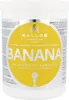 A white tub of Kallos Banana Hair Mask with a large yellow circular label featuring the product name and branding. Podgląd zdjęcia produktu