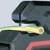 A close-up view of a wire stripper tool cutting a yellow and green insulated wire. Produktbild-Vorschau