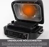 An open multi-cooker with its heating element glowing orange. Produktbild-Vorschau