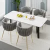 A dining set with a marble-top table and four chairs. Anteprima dell’immagine prodotto