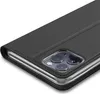 A close-up view of a black flip phone case with a silver trim, showing the camera lens area. Produktbild-Vorschau