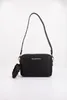 A black Valentino handbag with a detachable pouch is displayed against a white background. Voir les images du produit