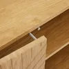A close-up view of a wooden cabinet drawer, showing the textured front and a metal drawer slide. Anteprima dell’immagine prodotto