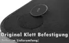 A close-up of a black car floor mat with a Velcro attachment system. Voir les images du produit
