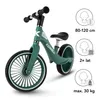 A green balance bike with white accents and black handlebars and seat, shown on a white background. Informational graphics are on the right side of the image. Voir les images du produit