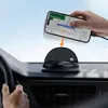 A hand is placing a smartphone with navigation displayed on a car dashboard mount. Náhled obrázku produktu