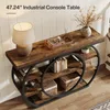 A console table with decorative items on it, placed in a room with wooden flooring and white walls. Náhľad obrázku produktu