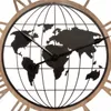 A close-up view of a wall clock with a world map design. Voir les images du produit