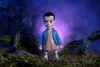 A stylized toy figure of Eleven from Stranger Things stands in a dark, misty forest setting. Anteprima dell’immagine prodotto
