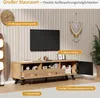 A wooden TV stand with a TV mounted on the wall above it, in a living room setting. Náhľad obrázku produktu