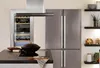 A modern kitchen scene with a refrigerator, wine cooler, and stovetop. Produktbild-Vorschau