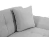 A close-up view of a gray sofa with a pillow. Náhľad obrázku produktu