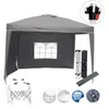A grey pop-up tent with two side panels, shown with its accessories and some circular icons indicating features. Náhľad obrázku produktu