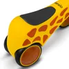 A close-up view of the front wheel and seat of a yellow toy ride-on vehicle with giraffe-like spots. Anteprima dell’immagine prodotto