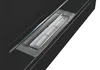 A close-up view of a black ethanol fireplace burner with a glass cover. Voir les images du produit