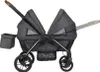 A side view of a dark gray double stroller against a white background. Voir les images du produit
