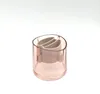 A pink translucent cylindrical holder with a beige insert, photographed against a white background. Podgląd zdjęcia produktu