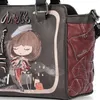Close-up of a handbag with a graphic design. Produktbild-Vorschau
