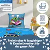 A bed with bedding featuring cartoon characters and informational icons. Produktbild-Vorschau
