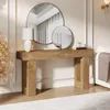 A wooden console table with decorative items and a lamp, placed against a wall with molding. Náhľad obrázku produktu