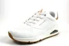 A studio shot of a single white Skechers sneaker against a white background. Náhled obrázku produktu