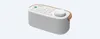 A white and gray Sony portable speaker with wood accents is shown against a white background. Voir les images du produit